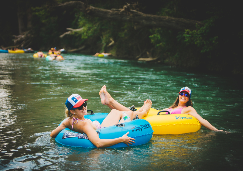 Two girls from a bachelorette party river tubing